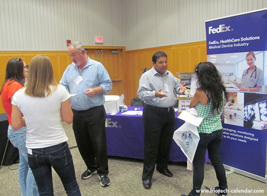 FedEx representitives give one-on-on explanations about new packaging aiming to help protect important lab equipment at the BioResearch Product Faire in Ann Arbor, Michigan
