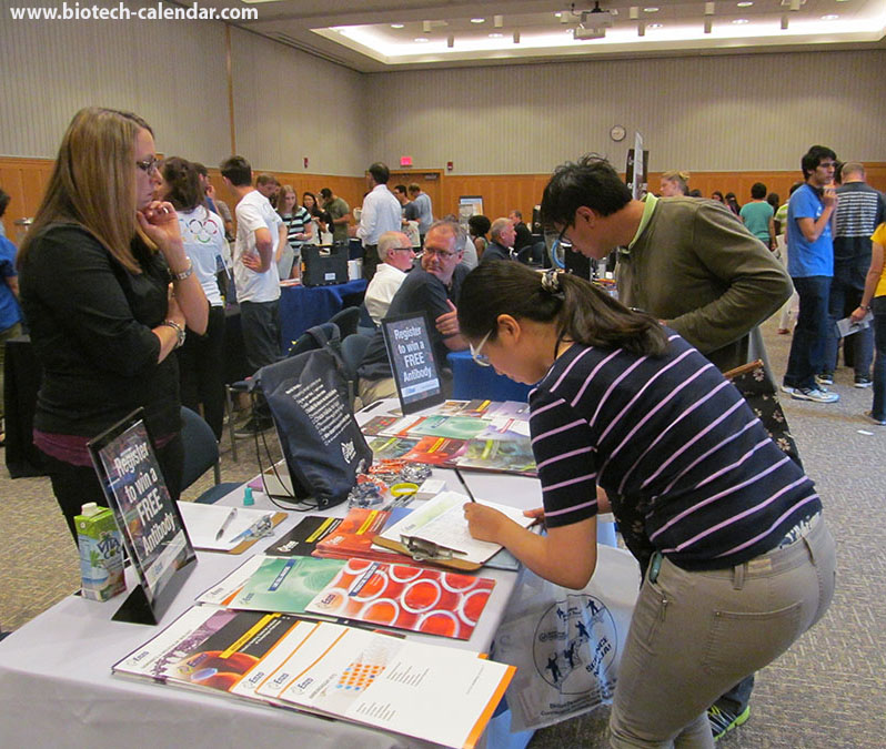 Scientists fill out pamphlets at the BioResearch Product Faire Event in Ann Arbor, Michigan